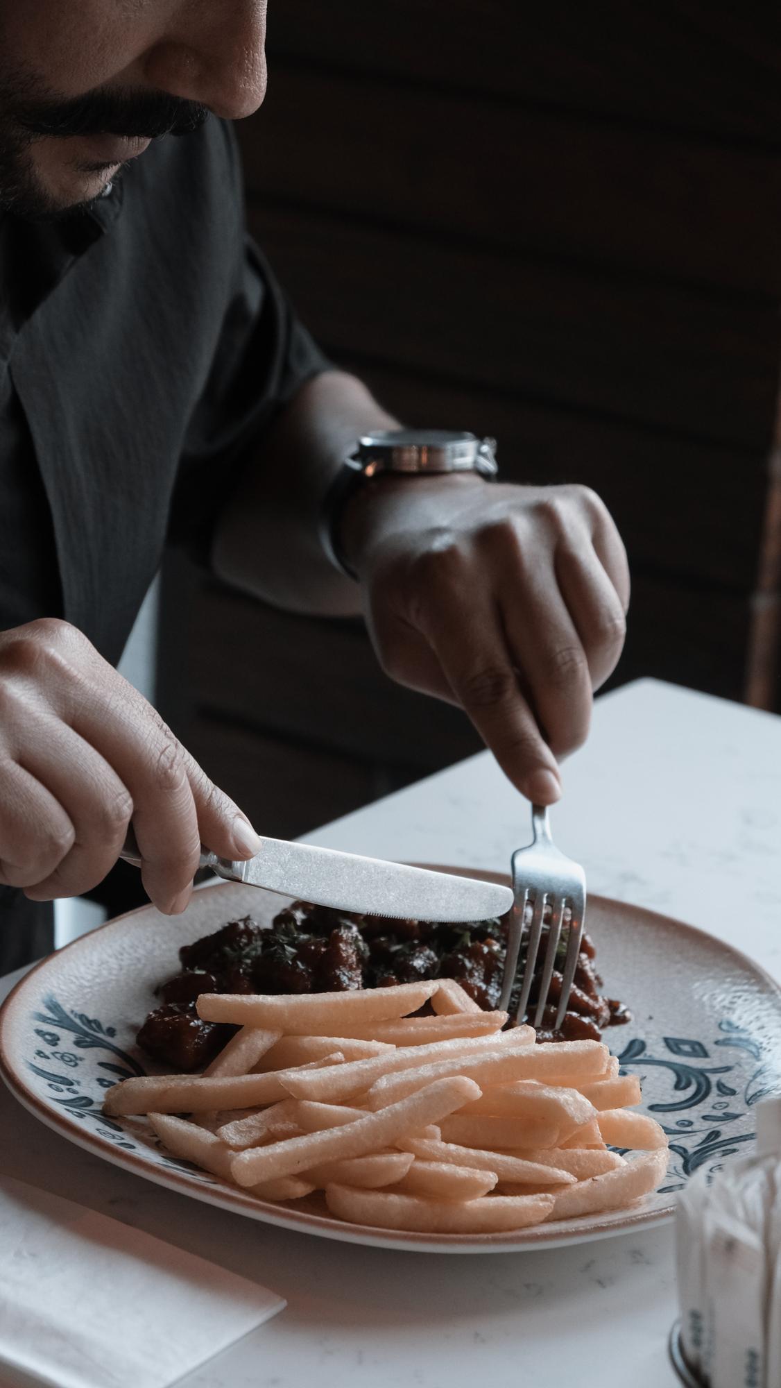 Chef working with plated desserts in a luxurious kitchen